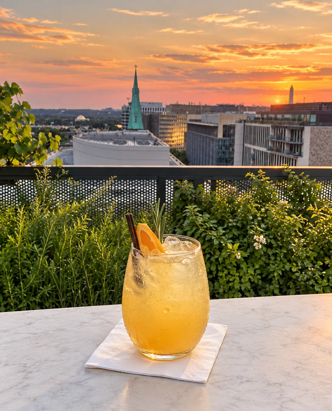Citrus and cinnamon mocktail on a D.C. rooftop at sunset
